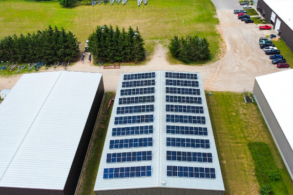 Commercial rooftop solar installation at Van Dam Boats showcasing renewable energy solutions for sustainable manufacturing.